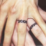Photo of a man and woman's hands, each with a tattooed wedding band around their ring fingers. Post called love tattoos in i love you often...just not always blog abut love and relationships and other good stuff.